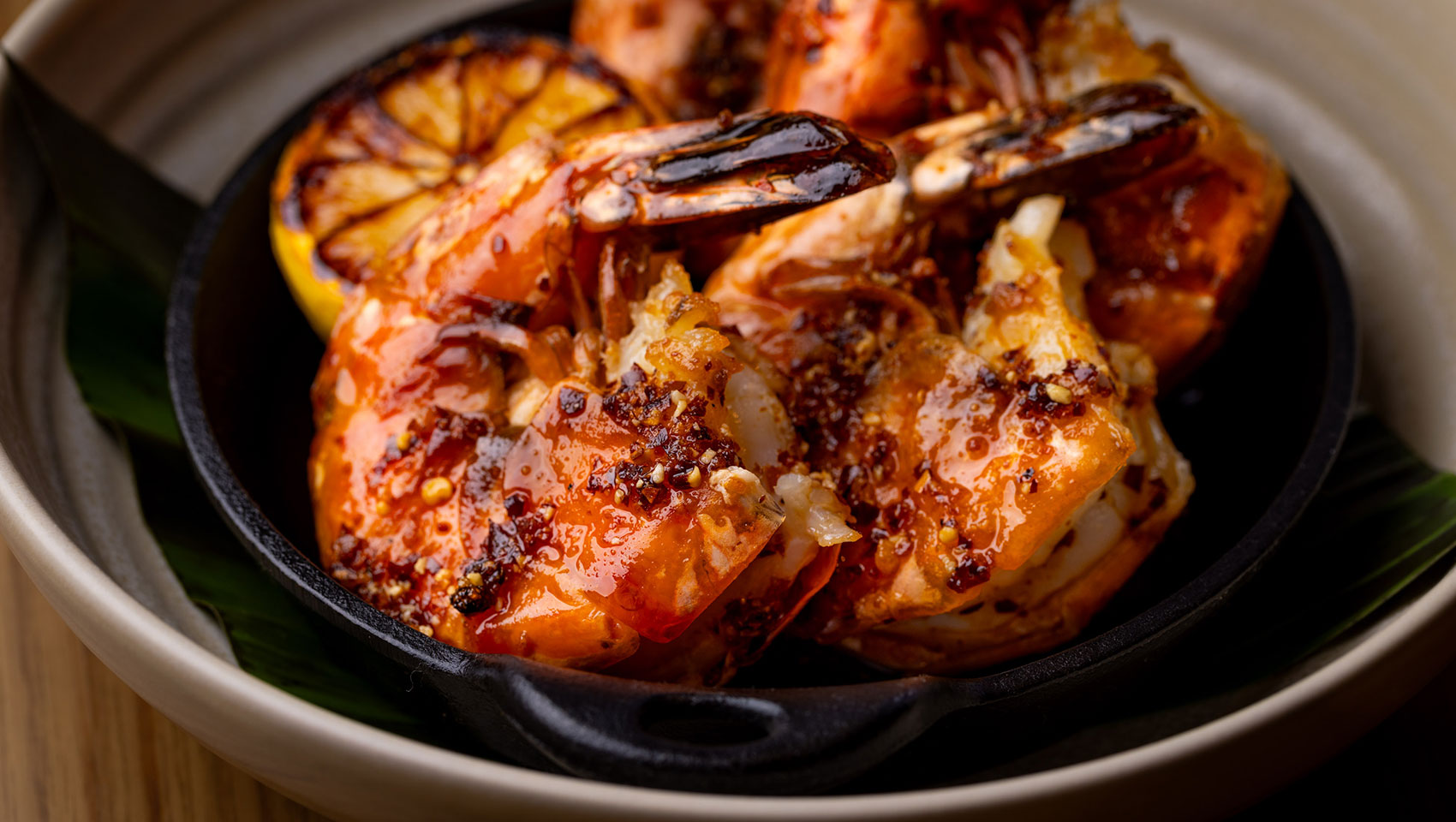 Chef preparing fresh dishes in the Hecho Libre open kitchen at Kimpton Miralina