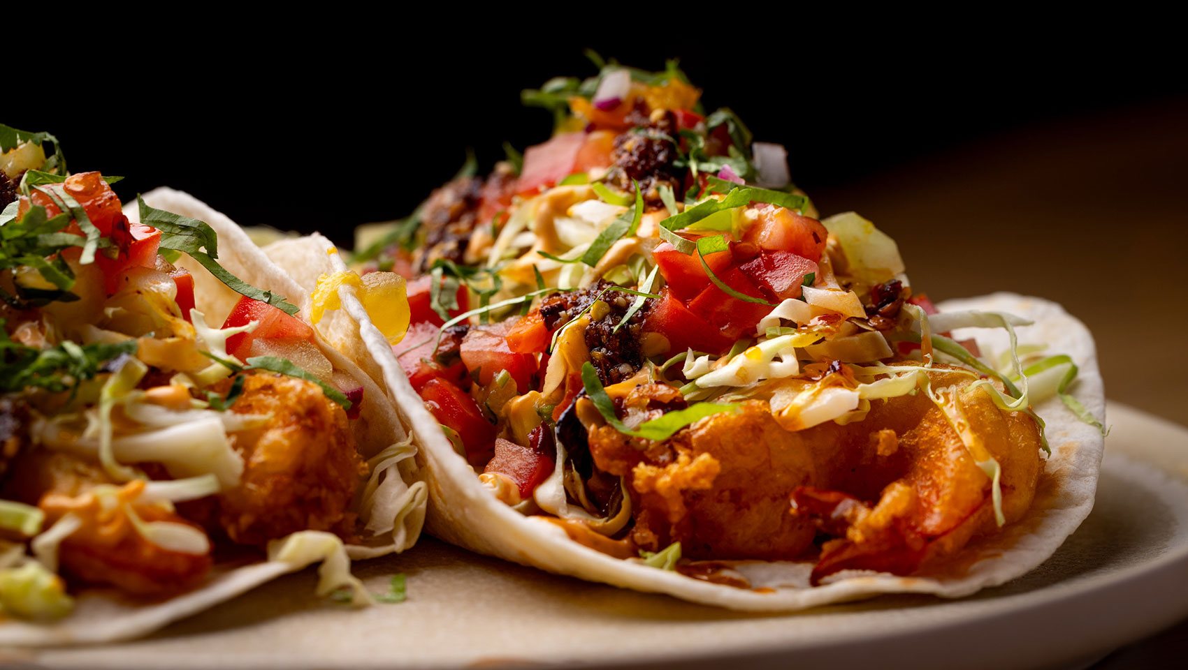 Outdoor dining patio at Hecho Libre with desert landscaping at Kimpton Miralina