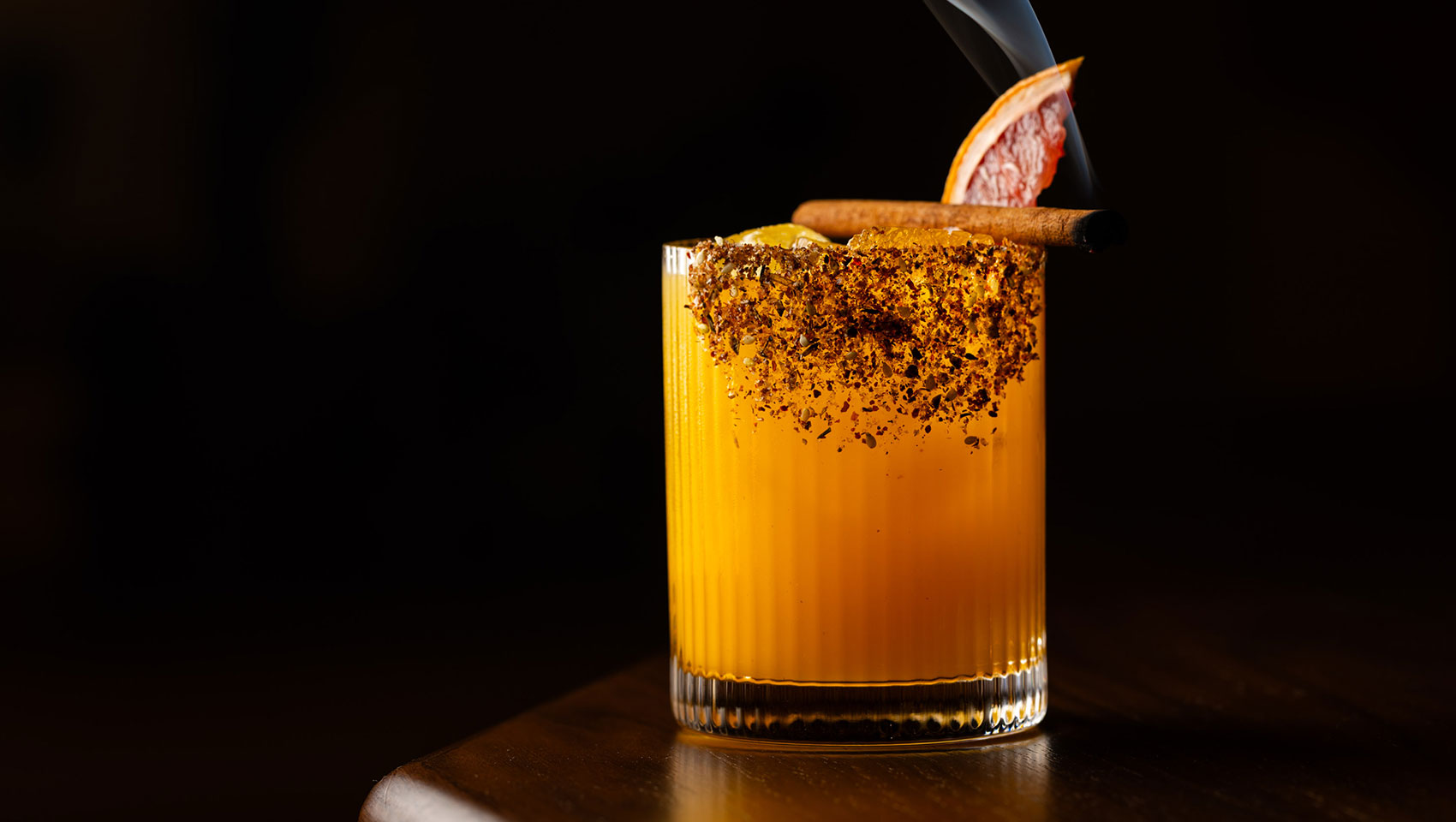 Hecho Libre bar at Kimpton Miralina featuring craft cocktails and warm desert lighting