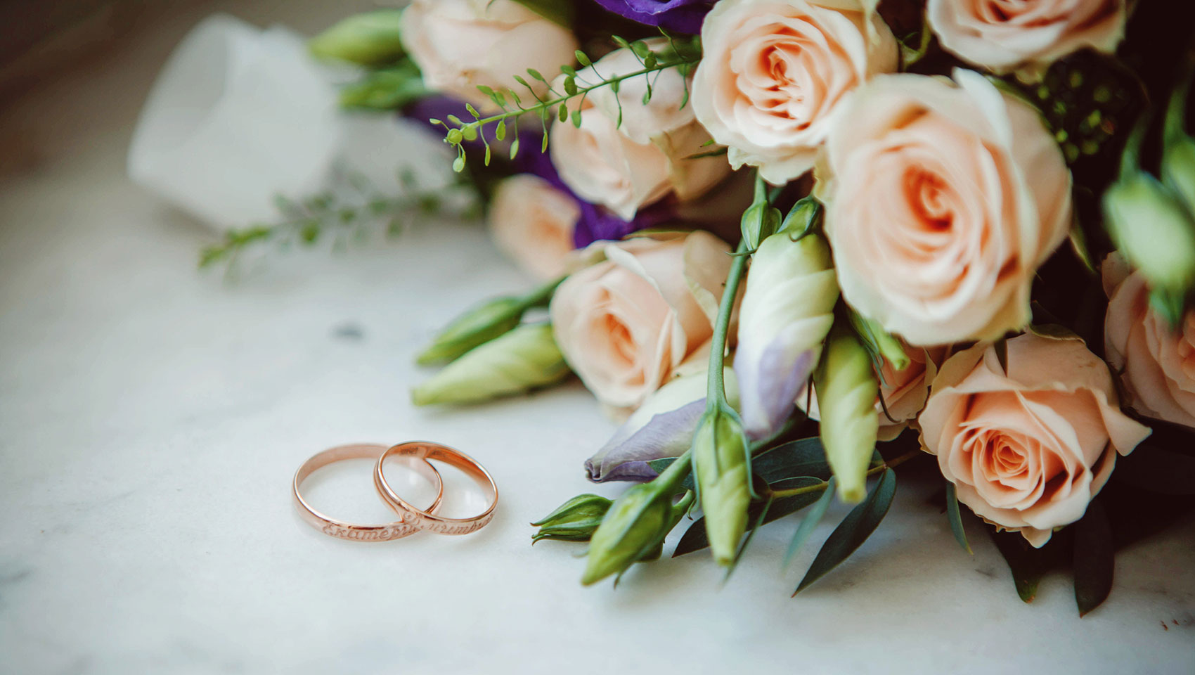 wedding rings and bouquet at Miralina