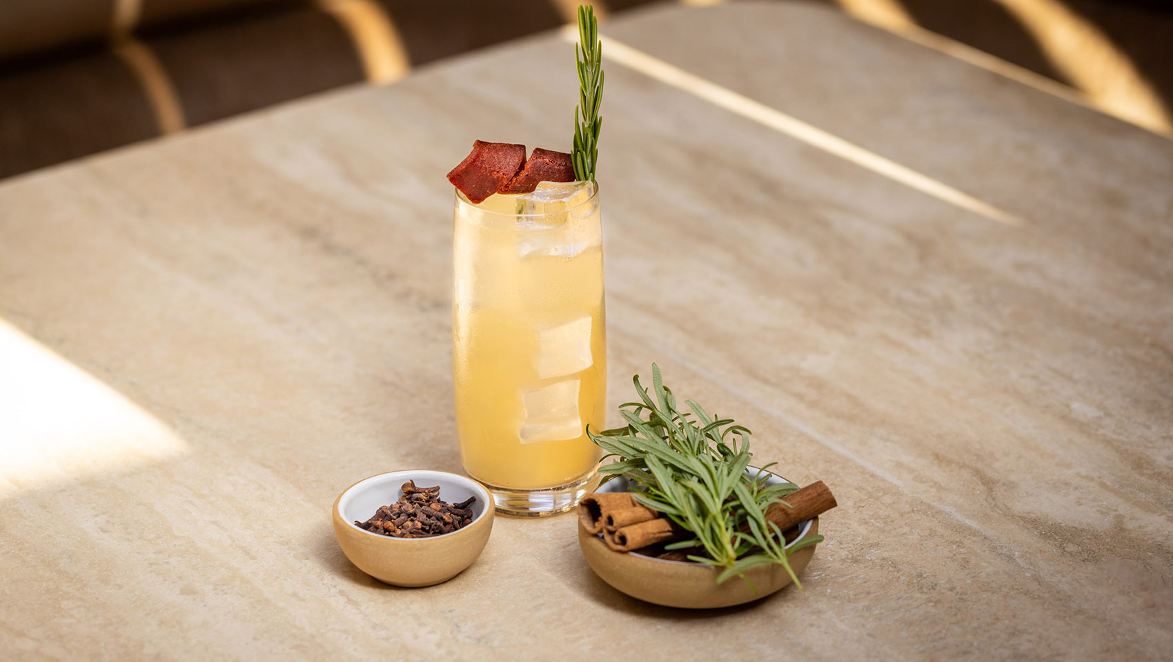 cocktail with sage garnish