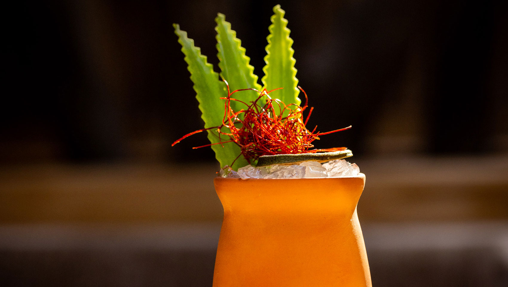 cocktail in clay cup with garnish