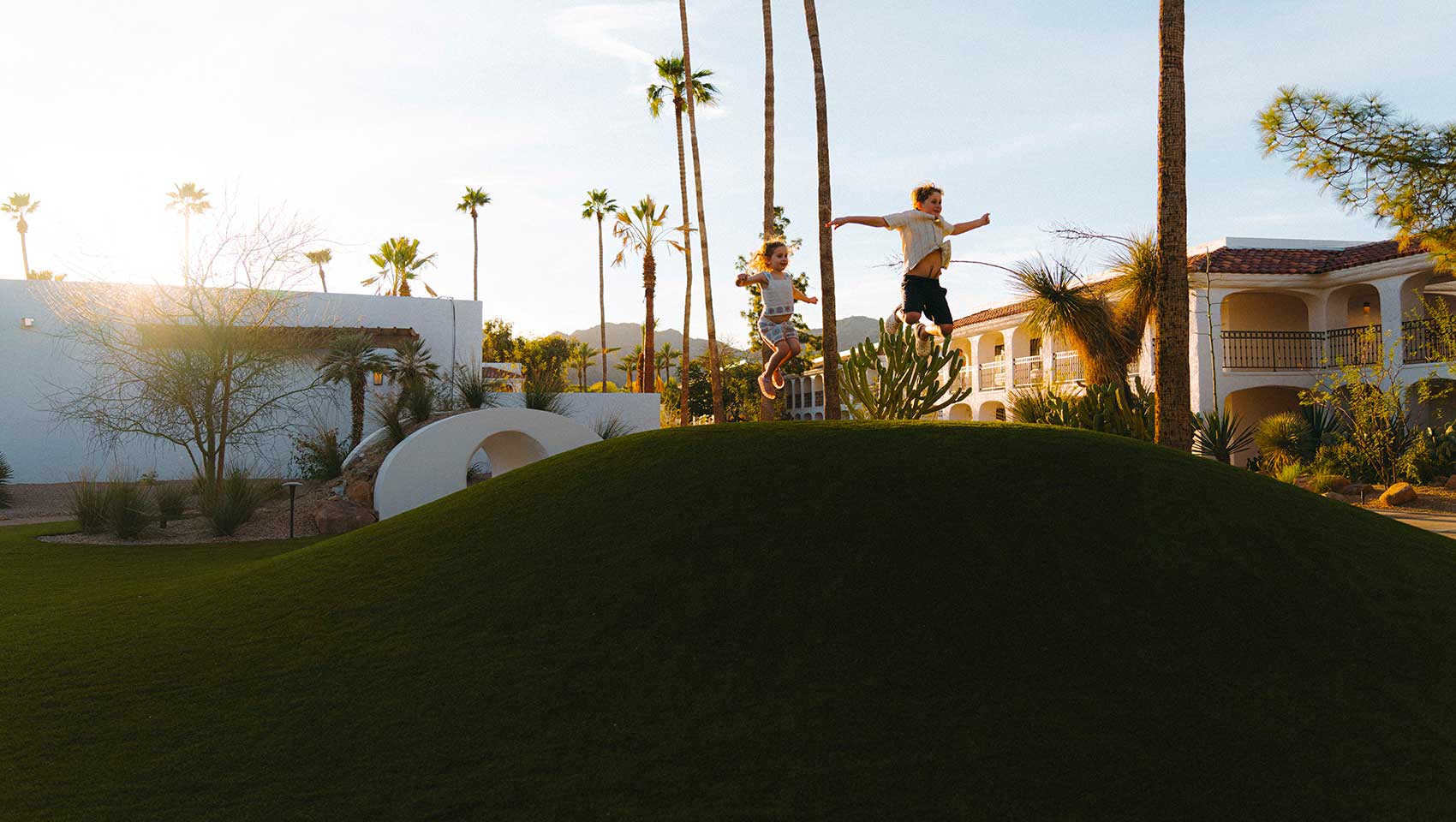 Kids at Kimpton Miralina jumping outside