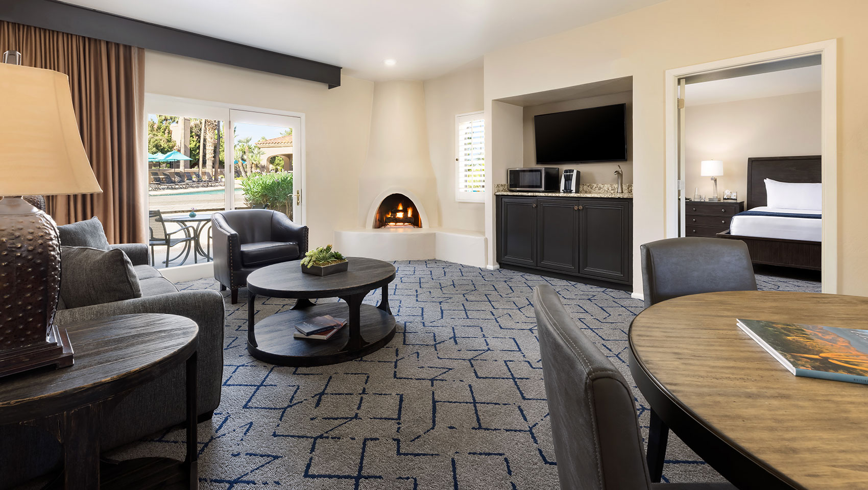 Miralina villa living room with fireplace and courtyard view