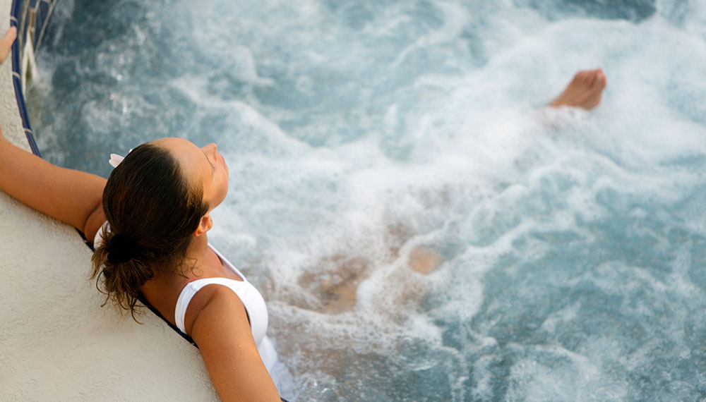 Woman relaxing in hot tub