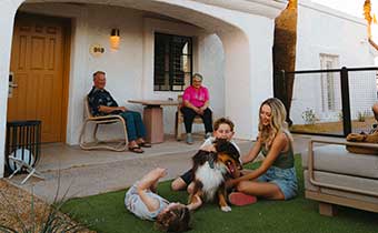 Family with dog in front of Canyon Casita