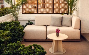 outdoor patio seating with a sofa at Kimpton Miralina