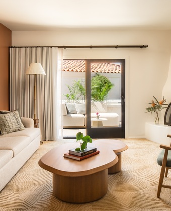 Valley Villa seating area with fireplace, sofa, coffee table and chair