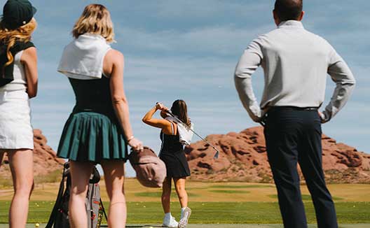 adults on the golf course