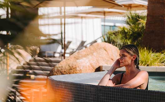 Tag: woman in outdoor hot tub at Kimpton Miralina Resort